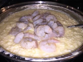 <p>Once the rice is close to being done add in the raw shrimp and continue to cook.</p>